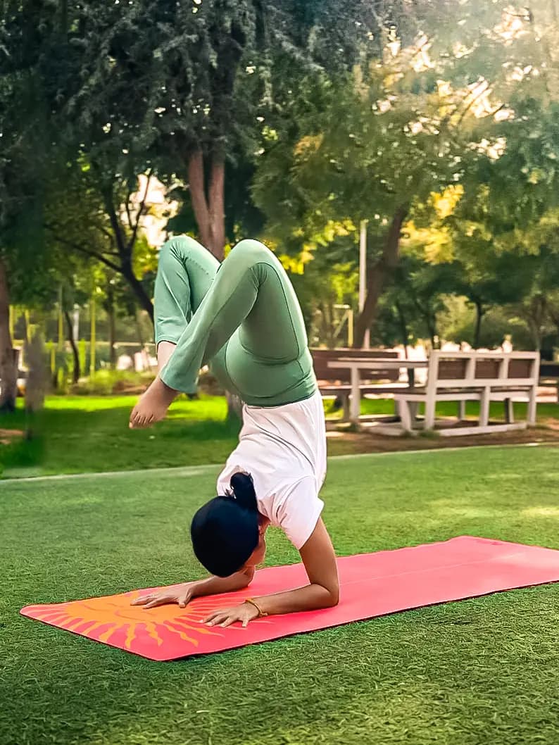 Vila practicing yoga in a sunlit Abu Dhabi studio, reflecting the mindful origins of Vila Ventures